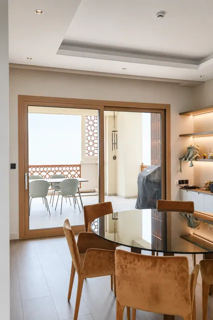 Dining area with timber-finish sliding door, Marina Residence 4